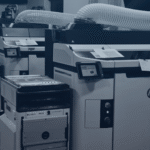 Several Impac Additive's HP-Jet-Fusion 5200 3D Printers with powder handlers next to them