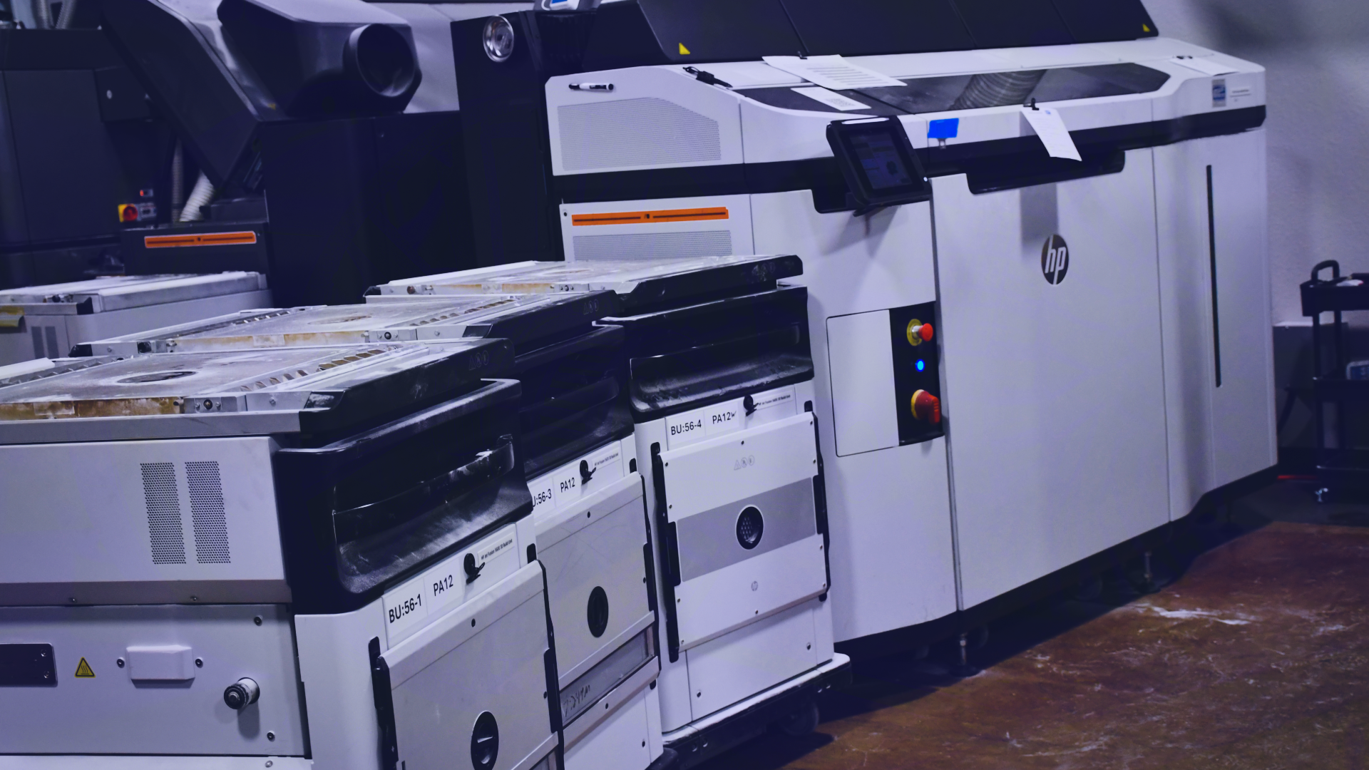 One of Impac Additive's HP-Jet-Fusion 5200 3D Printers with three powder handlers